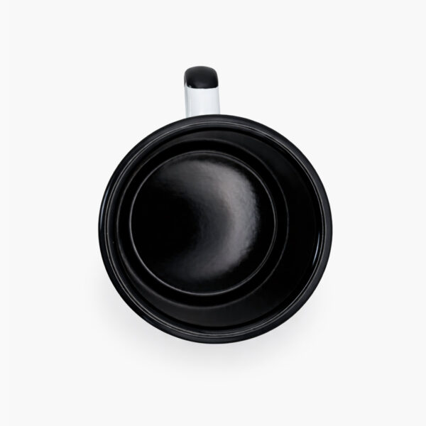 Top view of Coffee for a Change white enamel camping mug with black interior and handle