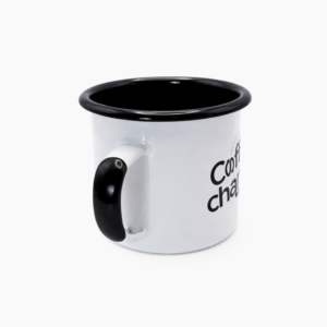 White enamel camping mug with black rim and handle on clean white background, side view product photo