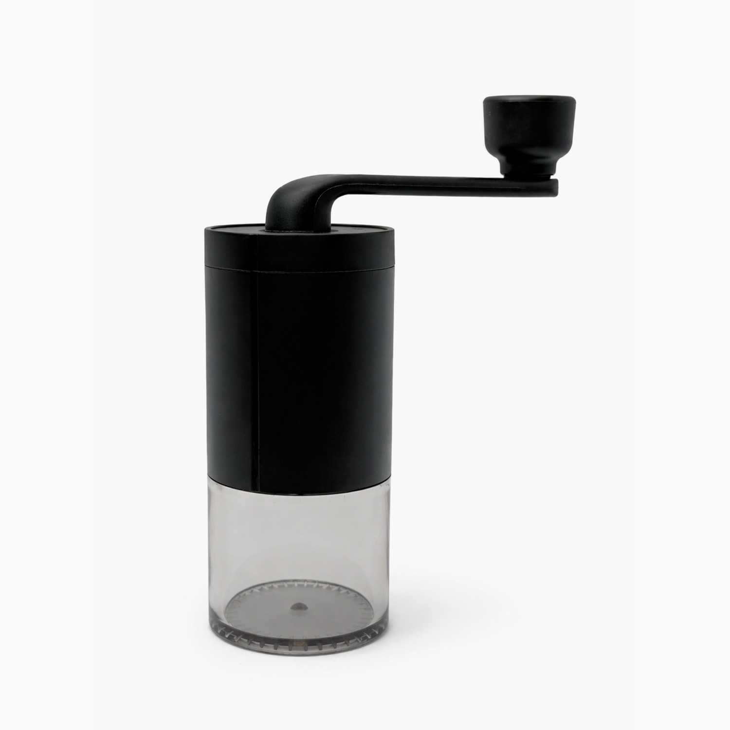 Manual coffee grinder with matte black body and clear grounds container