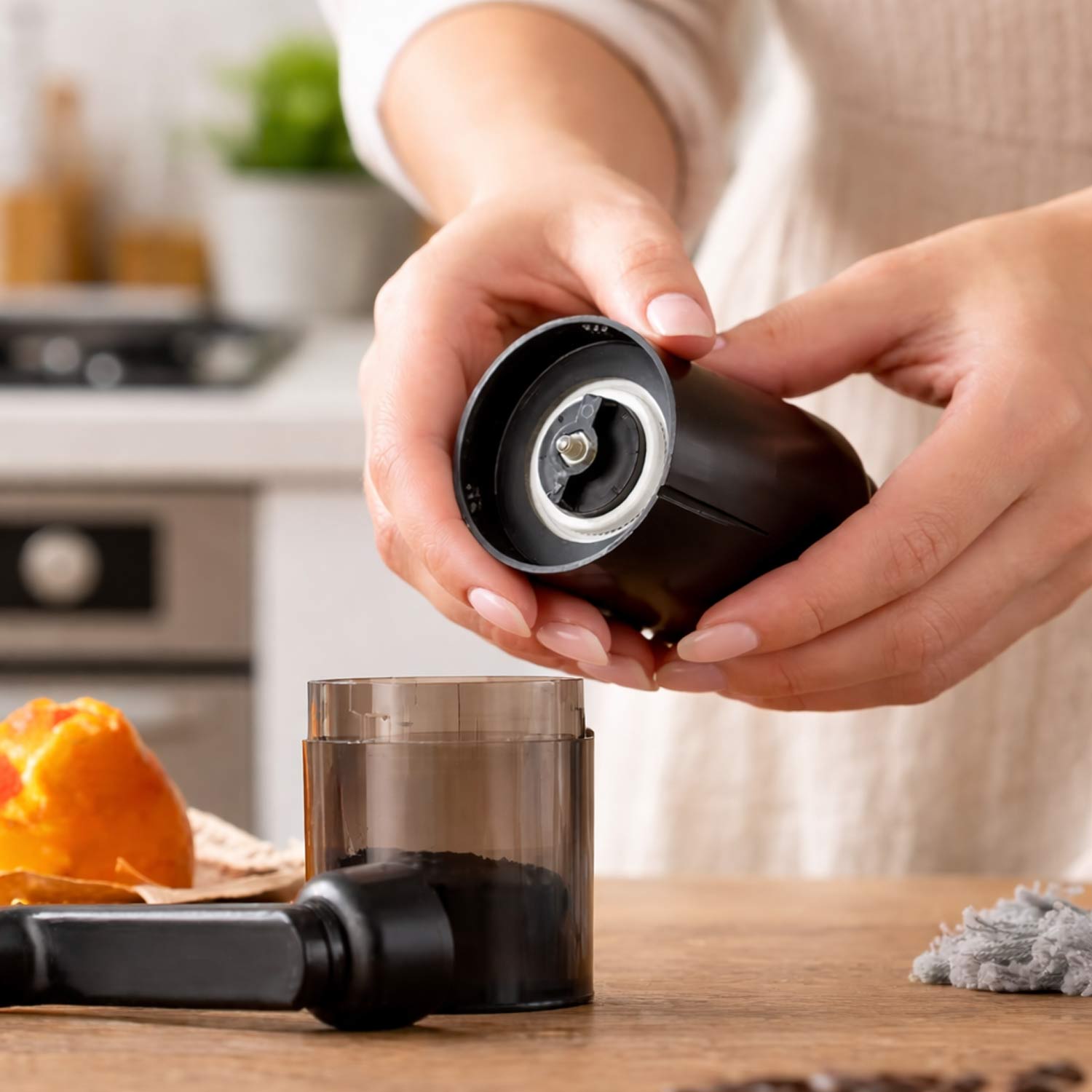 Manual coffee grinder in a modern kitchen setting