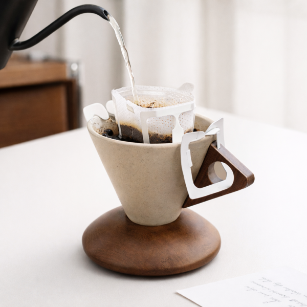 Minimal ceramic coffee cup with wooden base on a clean table